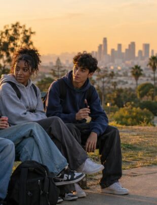 California teenagers sitting in a park during golden hour, socializing outdoors