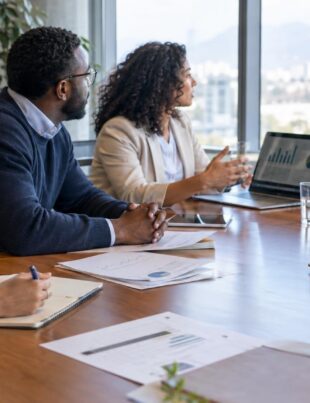 Advocates discussing cannabinoid regulation policy around a conference table with CBD products