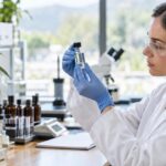 What is the Dietary supplements pathway for cannabis medicine? Scientist examining hemp extract vial in a bright laboratory setting
