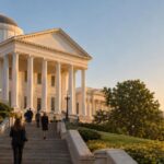 Virginia State Capitol building at sunrise with lawmakers approaching